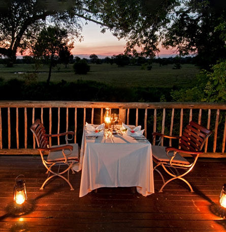 dinner table for two set outside at sunset in Africa