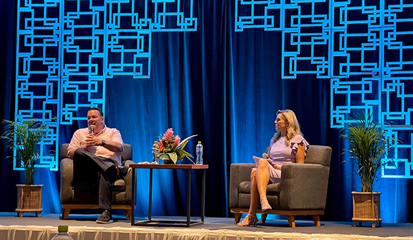 Ray Snisky and Jacki Marks speaking on stage