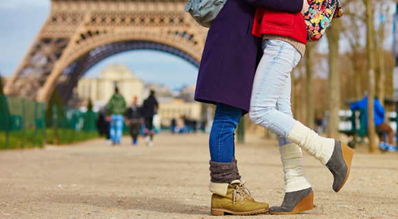 Couple embracing near Eiffel Tower in Paris